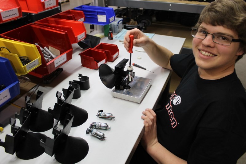 Devin Hill assembling the Ball Cannon's motorized carriage