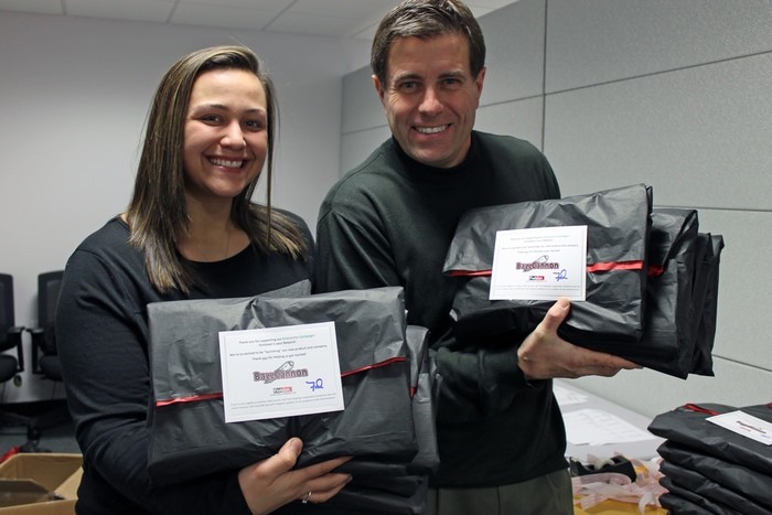 Fred and Kiana preparing to mail the Kickstarter rewards